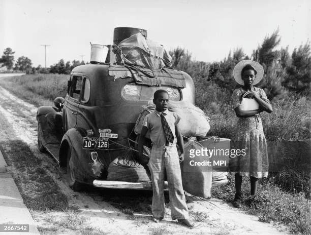 An African-American family leaving Florida during the Great Depression.