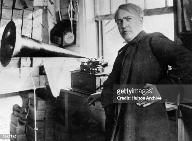 American inventor and businessman Thomas Edison with an Edison Standard Phonograph, at his lab in West Orange, New Jersey, 1906. The Edison Standard...
