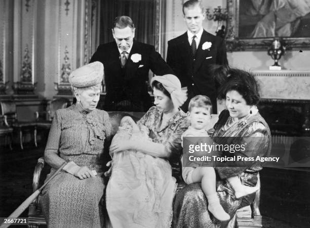 Princess Elizabeth holding Princess Anne with Queen Mary whilst Queen Elizabeth holds Prince Charles . King George VI and Prince Philip, Duke of...