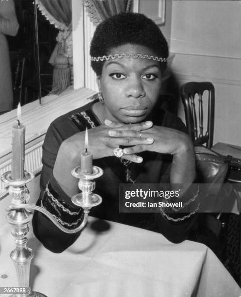 American soul, jazz and blues vocalist Nina Simone relaxes at the Hanover Grand during a reception held for her in London. She is here on a...