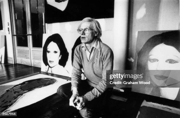 Artist Andy Warhol in New York with his latest work, 'Princess Of Iran'.