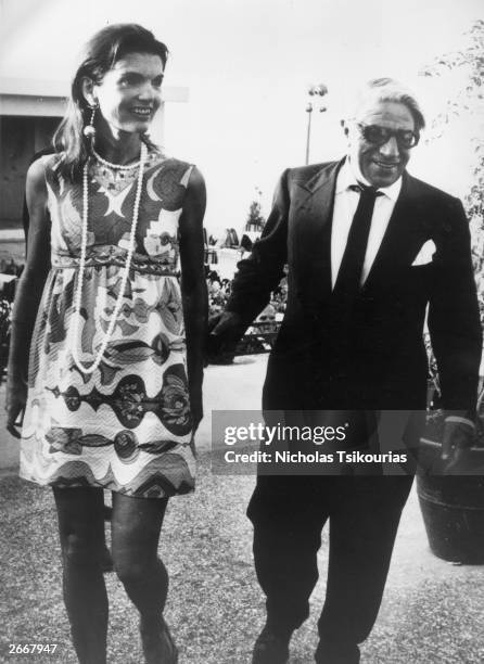 Jackie Onassis and her husband Aristotle Onassis leave an Athens nightclub at 7am after celebrating Jackie's 40th birthday.