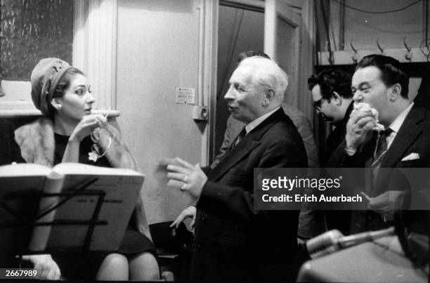 Soprano Maria Callas , conductor Tullio Serafin and tenor Luigi Tagliavini in the playback room at Kingsway Hall, London, listening to a recording of...