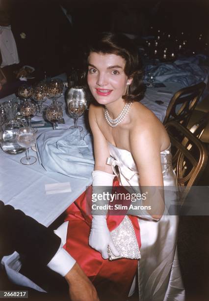 Premium Rates Apply. Jacqueline Kennedy wife of Senator Jack Kennedy at an 'April in Paris' ball, 1958. Original Artwork: A Wonderful Time - Slim...