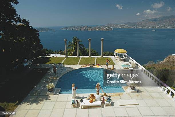 The pool at Villa Nirvana, Acapulco, Mexico. Old Acapulco can be seen across the bay.