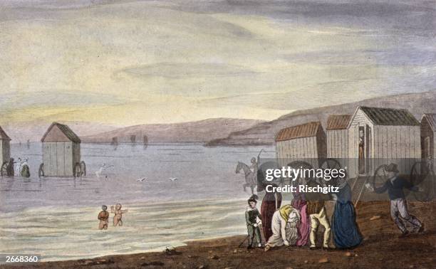 Huddle of bathing machines trundle into the sea at Scarborough, allowing demure tourists to swim in total privacy. Original Artwork: A print by J...