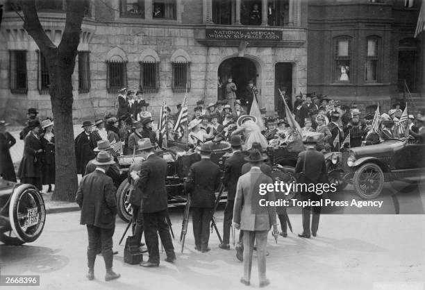 Crowd gathered around the car which will take Jeanette Rankin , the first female member of Congress, to be sworn in.