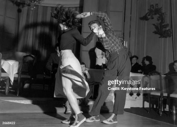 Jitterbugging students known as the 'Cellar rats from the Left Bank' implement their grants by performing in Paris night spots on the Champs Elysees.