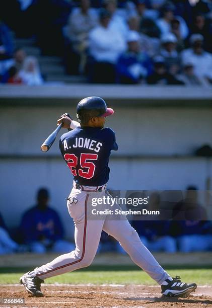 Outfielder Andruw Jones of the Atlanta Braves in action during a spring training game against the New York Mets at the Thomas J. White Stadium in...