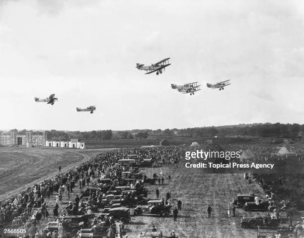 Day bombers fly over spectators at Hendon, during an RAF pageant and demonstration of 'evolution flying'.
