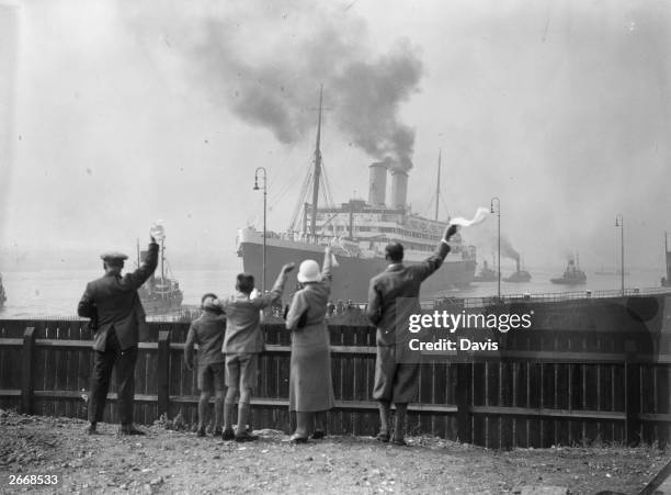 Well-wishers wave goodbye to Douglas Jardine and the other members of the MCC as they set sail from Tilbury to Australia on the Orient liner Orontes.