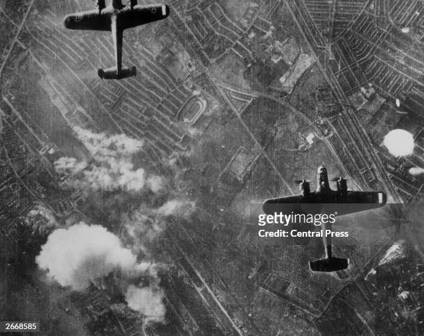 Two Luftwaffe Dornier 217 bombers flying over the Silvertown area of London's Docklands on 7th September 1940 at the beginning of the Blitz on...