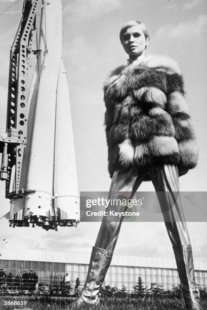 Space-age styling from Russian designers, as Moscovite model Galina Milovskaya wears a metallic ensemble with a red fox fur jacket, leggings and...