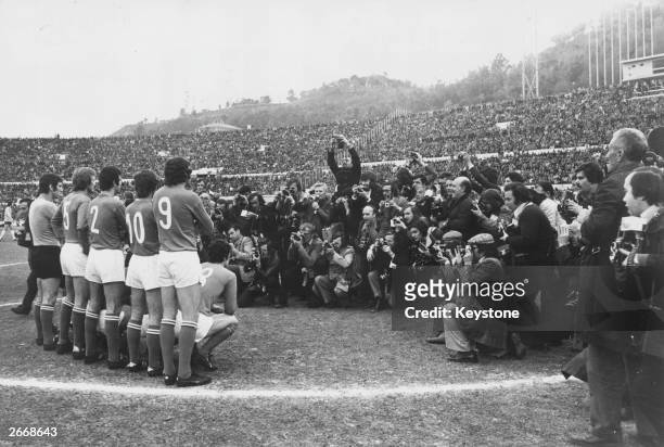 Large group of photographers photograph the Italian football team at the Olympic Stadium in Rome, before they take on West Germany in the European...