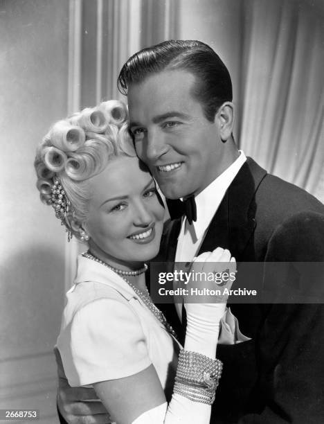 American actors, Betty Grable and John Payne during a scene from 'The Dolly Sisters' a Twentieth Century Fox musical film.