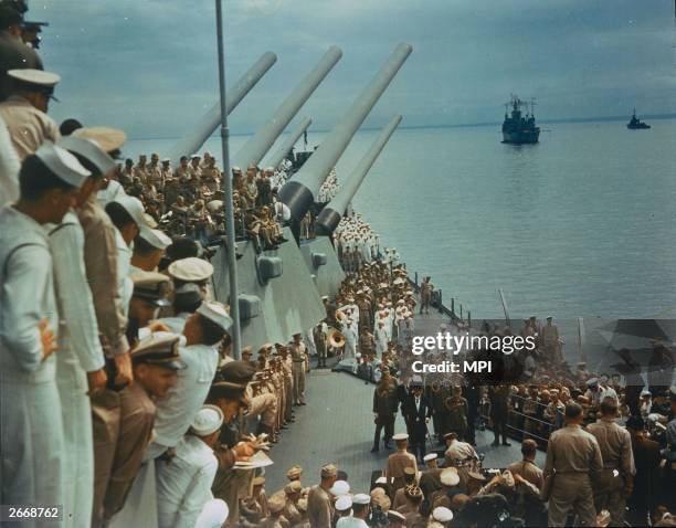 Soldiers and sailors on the decks of the USS Missouri to watch the Japanese surrender which was signed on board, Tokyo Bay, 2nd September 1945.