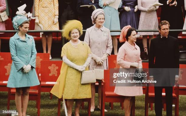 Queen Elizabeth The Queen Mother wearing a brightly coloured dress with Princess Anne Princess Margaret Rose , Countess of Snowdon and Antony, Lord...