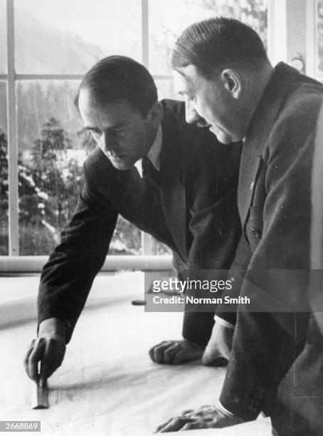 German architect Professor Albert Speer showing German dictator Adolf Hitler some of his plans for Berlin's new outline and buildings.
