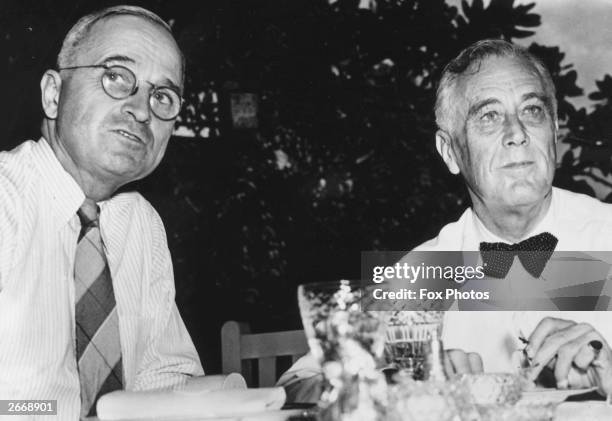 American president Franklin Delano Roosevelt with his vice-president and successor Harry S Truman on the lawn of the White House, shortly after both...