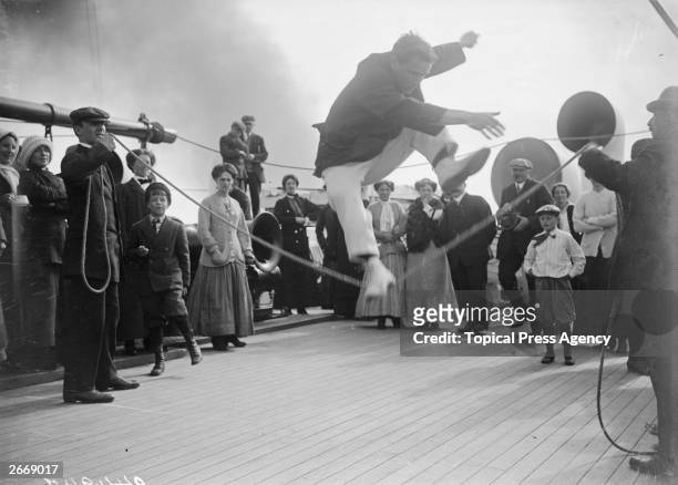 Passengers compete in a high jump contest on the deck of the Cunard cruise liner Franconia, which was destroyed by a U-boat in 1916.
