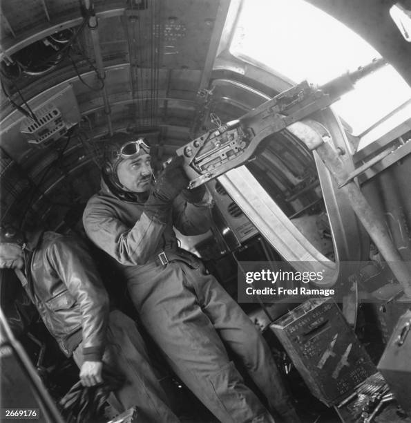Captain Clark Gable in his war time capacity as captain of gunnery at an American Bomber station 'somewhere in Britain'. Gable's main role is to...