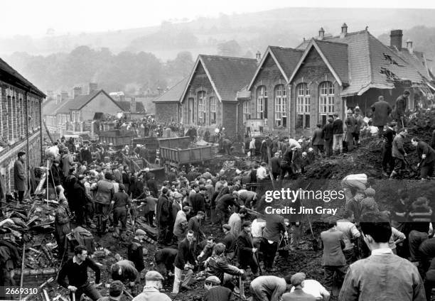 Rescue workers continue their search for victims of the Aberfan disaster, in South Wales, where 190 people lost their lives after part of the village...