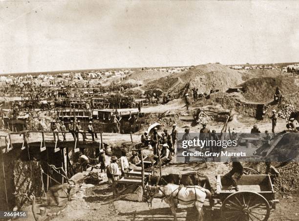 The Kimberley diamond mines in South Africa, to which thousands flocked in the 1870's after the discovery of diamonds on the nearby De Beers farm.