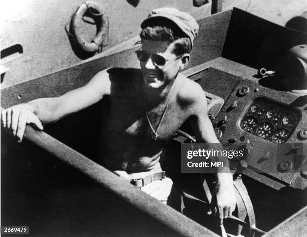 Naval Lieutenant and future President John F Kennedy on board the torpedo boat he commanded in the Southwest Pacific.