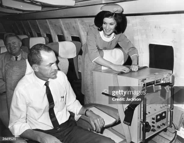 Two first class seats aboard a TWA jet from London to Washington. One occupied by a caesium beam timepiece accurate to one-millioneth of a second...