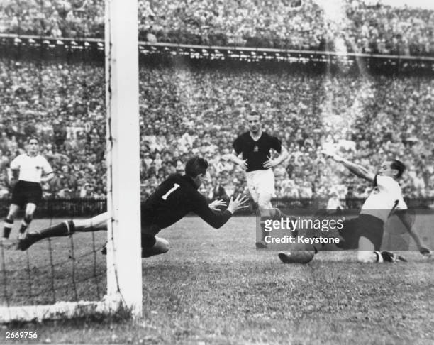 Morlock, West Germany's inside-right, scores against Hungary in the World Cup Final at Berne, Switzerland. Germany went on to become World Champions...