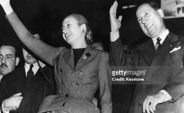 Argentinian president, Juan Peron, and his wife, Eva Peron , saluting a demonstration in their honour at Buenos Aires.