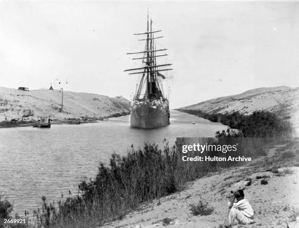 French frigate passes through the Channel of the Suez Canal, opened in 1869.