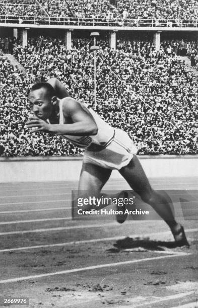 Jesse Owens of the USA at the start of the 200 metres at the 1936 Berlin Olympics which he won in 20.7 seconds, an Olympic record. He won three other...