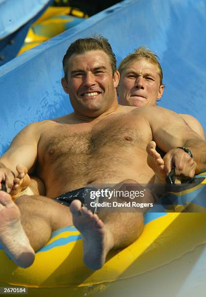 Jason Leonard and Josh Lewsey of England enjoy the waterslide at the Wet 'n' Wild theme park October 28, 2003 the Gold Coast, Australia.