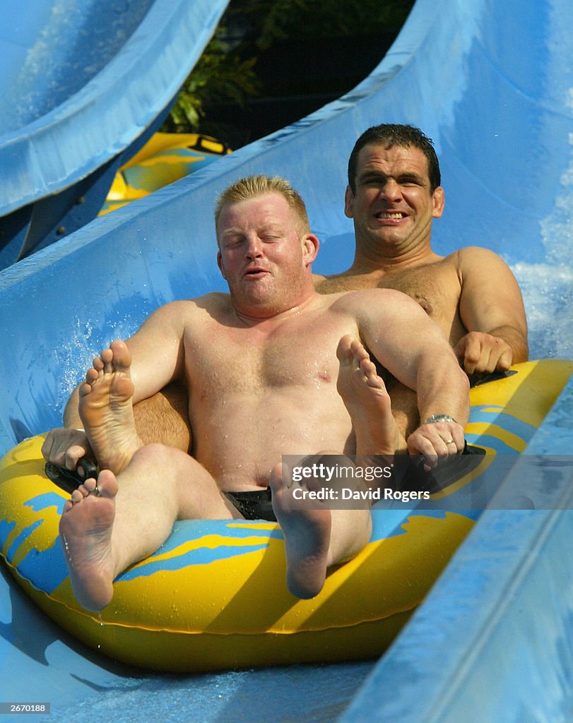  Dorian West (front) and Martin Johnson of England enjoy the waterslide...