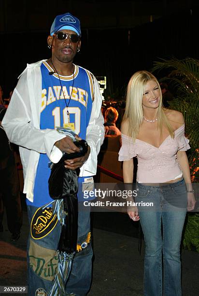 Former NBA player Dennis Rodman and actress Brande Roderick arrive at the 2003 Tall Pony Radio Music Awards gift lounge, outside the Aladdin Hotel...