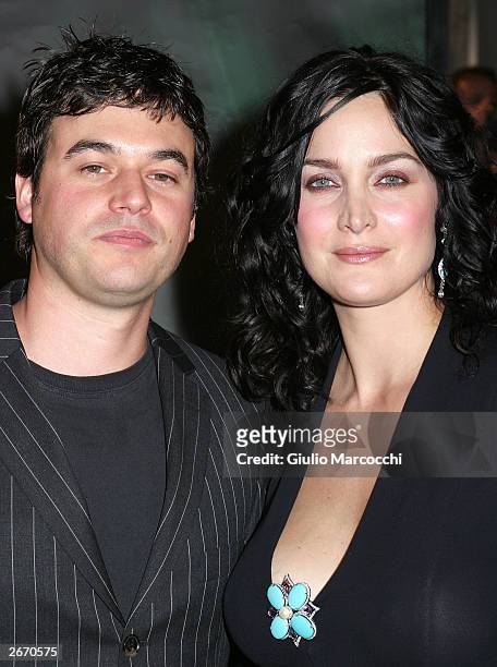Actress Carrie-Anne Moss and Steven Roy attend the film premiere of "Matrix Revolution" at the Disney Hall on October 27, 2003 in Los Angeles,...