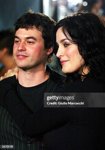 Actress Carrie-Anne Moss and Steven Roy attend the film premiere of "Matrix Revolution" at the Disney Hall on October 27, 2003 in Los Angeles,...