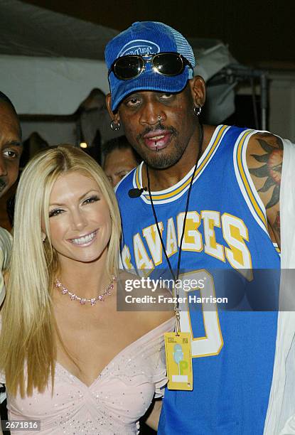 Former NBA player Dennis Rodman and actress Brande Roderick pose at the 2003 Tall Pony Radio Music Awards gift lounge, outside the Aladdin Hotel and...