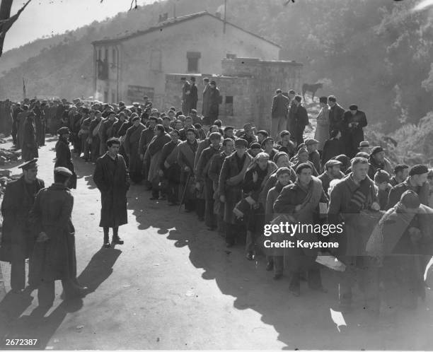 Some of the 3,000 members of the International Brigade, consisting of Poles, Czechs and Germans, entering the border town of Le Perthus with the...