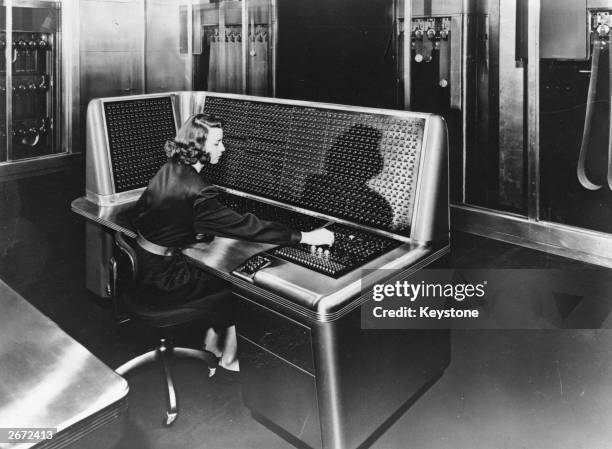 An operator at the control desk of the world's fastest calculator, the IBM Selective Sequence Electronic Calculator, in IBM's New York offices.