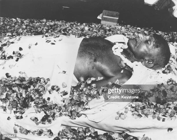 The body of Indian nationalist leader Mahatma Gandhi lying in state at Birla House, New Delhi, before the funeral cortege leaves for the burning...