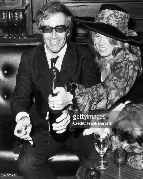 English comedian and actor Peter Sellers with his third wife, Miranda Quarry, at their wedding reception at 'Tramp' in Jermyn Street, with Miranda's...
