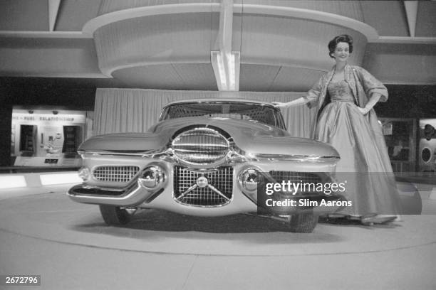 Fashion model with General Motors experimental sports car 'Le Sabre' , on show at the Waldorf Astoria, Park Avenue, New York.