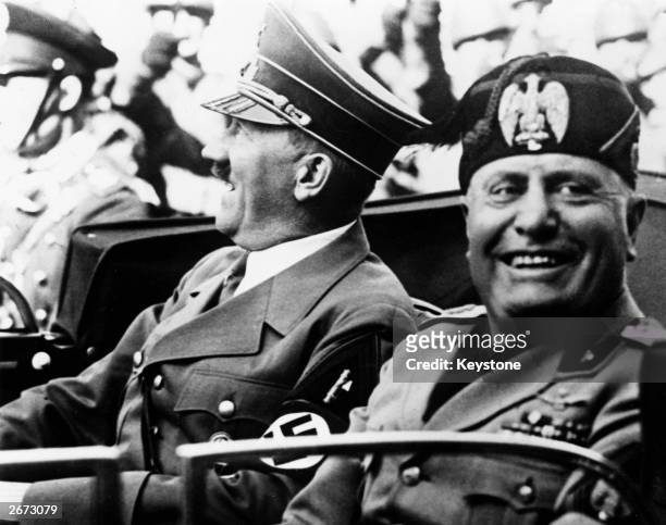 German chancellor Adolf Hitler and Italian dictator Benito Mussolini in jovial mood during a drive through the streets of Florence, Italy.