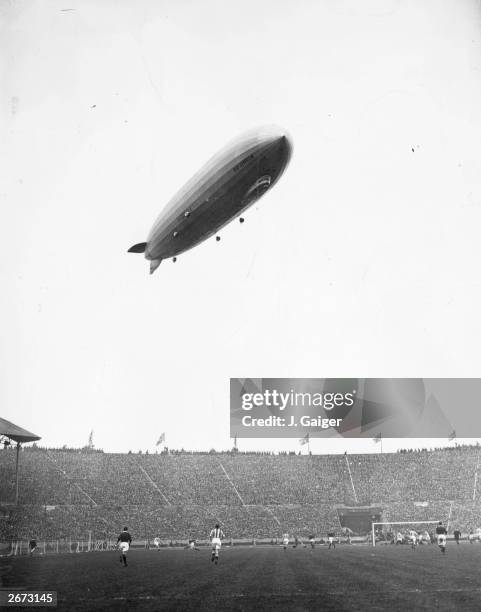 The Graf Zeppelin sails over Wembley Stadium during the FA Cup final between Arsenal and Huddersfield Town.