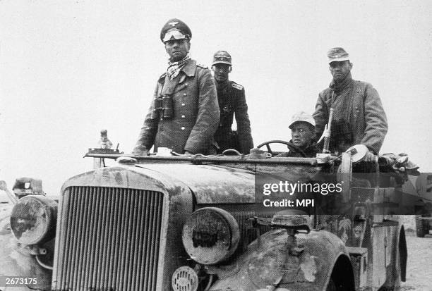 Field Marshall Erwin Rommel with the 15th Panzer Division in North Africa takes a ride in the front of a 'jeep'.