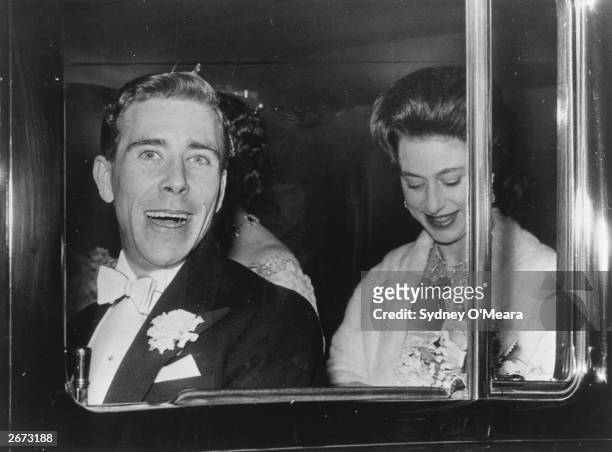 Antony Armstrong Jones and Princess Margaret in their car. They are returning to their London home, Clarence House after going to a show.