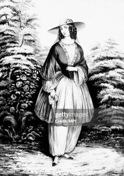Lithograph by Nathianel Currier entitled 'The Bloomer Costume' shows a woman dressed in fashion designed to avoid the restrictions of corsets and...