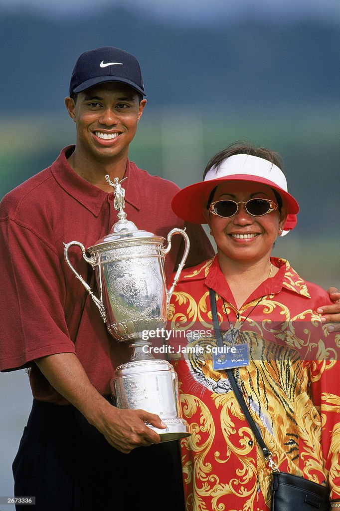 Tiger Woods and Kultida Woods with trophy